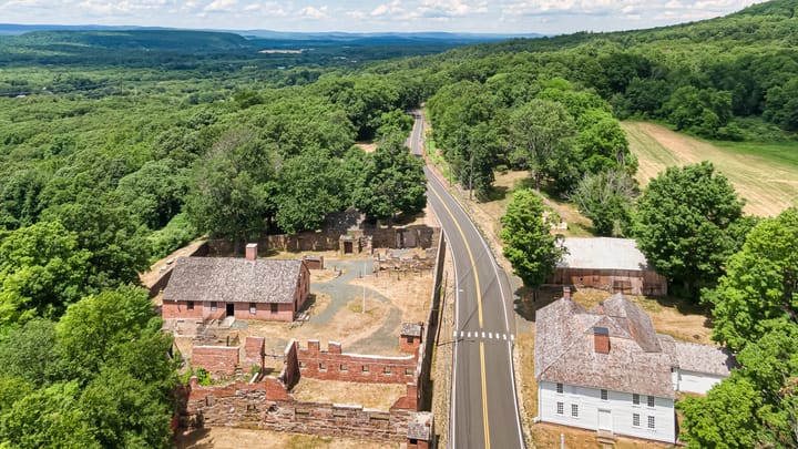 drone view of Old Newgate prison and museum site in lush green Connecticut